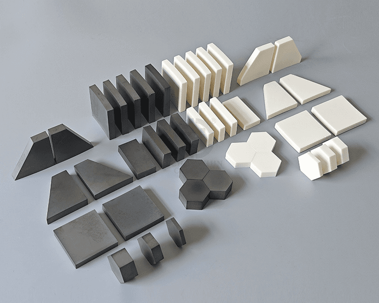 Ballistic ceramic armour tiles in boron carbide, silicon carbide, and aluminium oxide